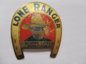 lot 33 image: 1930s Lone Ranger -Silvers Lucky Horseshoe Pinback Badge