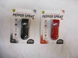 lot 69 image: HIS AND HERS GUARD DOG-PEPPER SPRAY, THE STYLISH KEYCHAIN