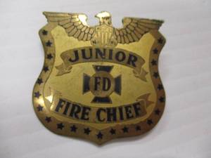 lot 70 image: Vintage Junior Fire Chief Pinback Metal Badge