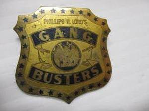lot 83 image: Vintage Phillips H. Lords Gang Busters  Pinback Metal Badge.