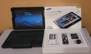 lot 11 image: SAMSUNG GALAXY TAB 2 10.1 WITH CHARGER AND CASE AS SHOWN.