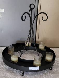 lot 51 image: BLACK WROUGHT-IRON STYLE CANDLE HOLDER IN DESIGN AS SHOWN. APPROX. 16.5 W X 18.25 H.