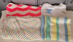 lot 59 image: LOT OF 4 KNITTED BLANKETS IN COLOR AND DESIGN AS SHOWN.