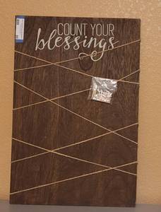 lot 80 image: NEW, HOBBY LOBBY COUNT YOUR BLESSINGS PHOTO HOLDER WITH CLIPS AS SHOWN. APPROX. 16 W X 24 H.