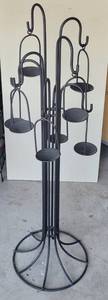 lot 115 image: LARGE WROUGHT IRON STYLE SELF STANDING CANDLE HOLDER IN STYLE AND DESIGN SHOWN.