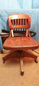 lot 29 image: vintage to antique rolling desk chair with movable back