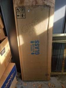 lot 124 image: Piece of tabletop glass  24 by 48 -  DIFFERENT LOCATION - Pickup 011722