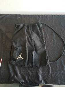 lot 28 image: Black Nike backpack