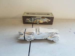 lot 38 image: Silver Duesenberg Avon aftershave decanter with box
