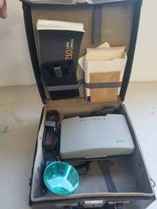 lot 243 image: Vintage Polaroid 210 camera and case