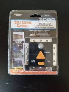 lot 299 image: LYNX 12-LED LIGHT WITH MOTION AND DAWNDUSK SENSORS  BLACK- #00027B