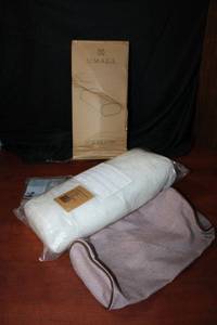 lot 93 image: Umage Lounge Side Pillows, 4 Total (4 Dusty Rose) Each measures 10x45x20cm