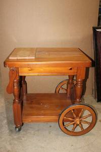 lot 167 image: Kitchen Tea Trolley Cart -  features Felt lined Drawer, Moveable Handle, large back wheels and cutting board on top PROCEEDS FROM THIS ITEM GOES TO SHARE-FEST TEXAS