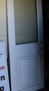 lot 173 image: This is not your standard size door (Measures 32 Wide and 8 Feet Tall) - Glass and Pet safe Door, One side is white and the other is Taupe Brown Color