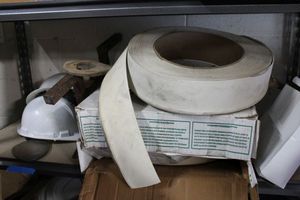 lot 179 image: Hard Hats, Rubber baseboard Liner, Wooden Paddle