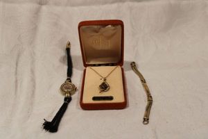 lot 189 image: Gold filled jewelry. Includes 12K gold filled Fairfax watch, 12K watch band and Tigers Eye pendant and chain in box (unmarked)