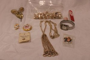 lot 191 image: Fashion jewelry selection. Includes Braniff pendant watch, Mary-Kate and Ashley watch, lapel pins, necklaces and more