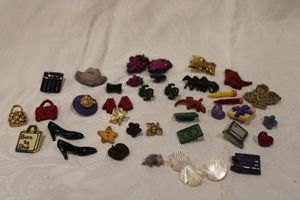 lot 203 image: Vintage and early plastic  Lucite figural buttons. Includes 3 hand carved thick mother of pearl buttons.