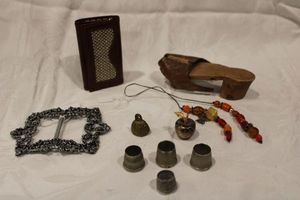 lot 210 image: Vintage collectibles including thimbles, hand crafted shoe, metal buckle, glass bead book marker plus