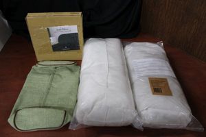 lot 92 image: Umage Lounge Side Pillows, 6 Total  (4 Dusty Rose, 1 Spring Green and 1 Silver Gray) Each measures 10x45x20cm