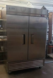 lot 1 image: WORKS GREAT  Titan Refrigeration XTR49-BM Double Door Bottom Mount Upright Reach-In Refrigerator w Rolling Casters - 54L x 33.5W x 83.5H, See Temperature Reading in Photo 2