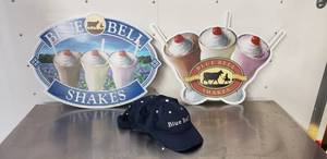 lot 46 image: Lot of Blue Bell Ice Cream Merchandise - 2 Signs and 5 Hats
