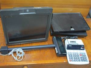 lot 32 image: NCR POS SYSTEM WITH KEY, LOGIC CONTROLS REGISTER DISPLAY, CANON BUSINESS MACHINE CALCULATOR WITH TAPE PRINTER, 2 APG CASH DRAWERS WITH LIDS.&nbsp