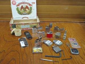 lot 15 image: VINTAGE LIGHTER LOT W WOODEN CIGAR BOX &amp TOOLS, BRANDS SUCH AS CAMEL, CROWN DESIGN, NOBLE, OMEGA, ZIPPO &amp MORE