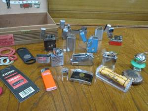 lot 10 image: LOT OF VINTAGE LIGHTERS W WOODEN CIGAR BOX, INCL. EXTRA WICK, CIGAR CUTTER, CIGARETTE ROLLER, SOME BRANDS ARE RONSON, PRINCE MFG. CO., ZIPPO &amp MORE, SEE PICS