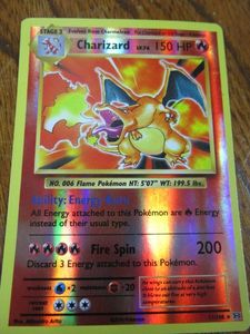 lot 13 image: 2016 POKEMON CARD CHARIZARD, REVERSE HOLOGRAPHIC, RARE, LAST YEAR OF THE XY SERIES, 11108 IN SERIES SET