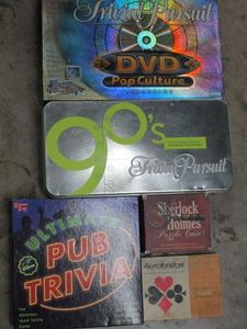 lot 105 image: BOARD GAMES- TRIVIAL PURSUIT 90S EDITION, POP CULTURE DVD TRIVIAL PURSUIT, ULTIMATE PUB TRIVIA, SHERLOCK HOLMES GAME, AUTOBRIDGE