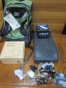 lot 104 image: WIRELESS HEADPHONES IN BOX, HIGH POWER HEAD LAMP IN BOX, WEB GRIP MOUNT PHONE GPS NAVIGATION CRADLE HOLDER, COLEMAN ELATE 14L HYDRATION BACKPACK WITH TAGS, MOTORCYCLE SEAT
