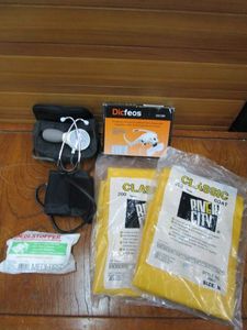 lot 107 image: SPHYGMOMANOMETER , 2 NEW IN PACKAGING RIVER CITY PROTECTIVE WEAR COAT SIZE M, DICFEOS EYEGLASSES BRACKETHEADBAND INTERCHANGEABLE MAGNIFIER WITH 2LED IN BOX, TRAUMA BANDAGE