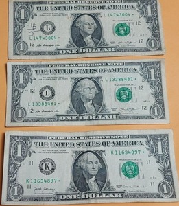 lot 67 image: (3) $1 star notes