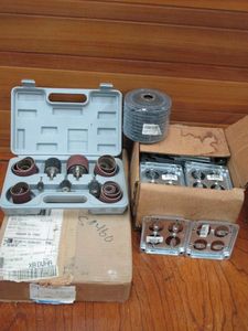 lot 122 image: DRILL BIT SANDING WHEELS W CASE, 40 GRIT SANDING FLAP DISCS, ELECTRICIAN METAL RECEPTICAL COVERS