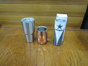 lot 152 image: YETI INSULATED SILVER CUP WITH LID, NEW IN BOX COWBOYS INSULATED CUP WITH LID, COPPER MULE MUG WITH HANDLE.&nbsp