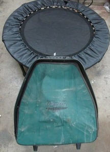 lot 203 image: FOLDING EXERCISE TRAMPOLINE, VERY STURDY, FOLDS TO ABOUT 13 OF OPEN SIZE, COMES WITH LUGGAGE STYLE CARRYING CASE WITH HANDLE AND WHEELS