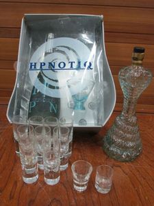 lot 217 image: HYPNOTIC GIFT PACKAGE W (2) GLASSES INCL., SEVERAL SHOT GLASSES, COLLECTIBLE ARMENIAN BOURBON BOTTLE SHAPED AS COBRA, BOTTLE IS EMPTY