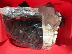 lot 35 image: Red tote full of new and used purses