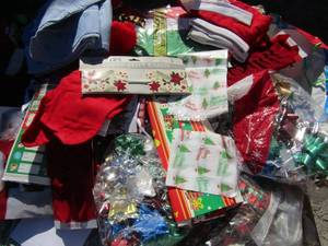 lot 38 image: Christmas lot Bags bows, names tags, tin cans, table runner