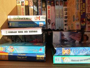 lot 39 image: Box of assorted VHS tapes kids comedy westerns
