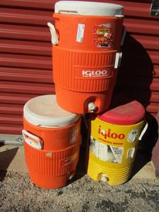 lot 41 image: 2 orange igloo 5 gallon water jugs 1 yellow 5 gal water jug