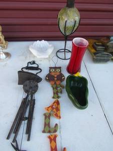 lot 71 image: Iron wind chime owl wall hanger, oil lamp, redblack vase, praying hands, pepper