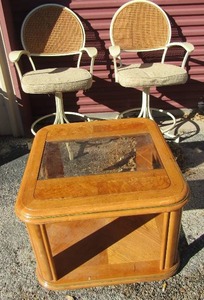 lot 21 image: COFFEE TABLE & 2 BAR HEIGHT CHAIRS - TABLE IS WOOD WITH GLASS INSERT, CHAIRS WHITE W WICKER BACKS
