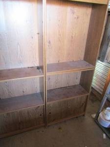 lot 147 image: 2 wooden book shelves with sliding doors at bottom 60x24 x 9