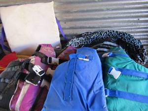 lot 196 image: Green tub of pool floats (unknown condition) and child and adult life jacket