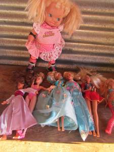 lot 221 image: Roller blade baby doll and 6 Barbies great condition