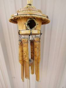 lot 305 image: Wooden wind chimes, bird house