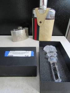 lot 34 image: Versace boxed glass bottle stopper and 2 whisky flasks - one is Gucci style