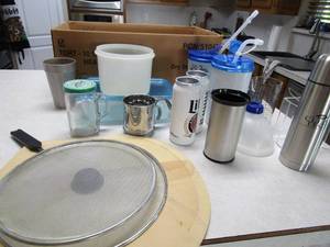 lot 48 image: Large hand held pizza board. Miller light aluminum cups, and more
